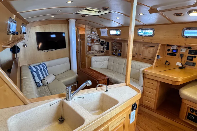 Munequita Yacht Photos Pics Luxurious interior of 2013 Tartan 4000 yacht with modern amenities and wooden finishes.