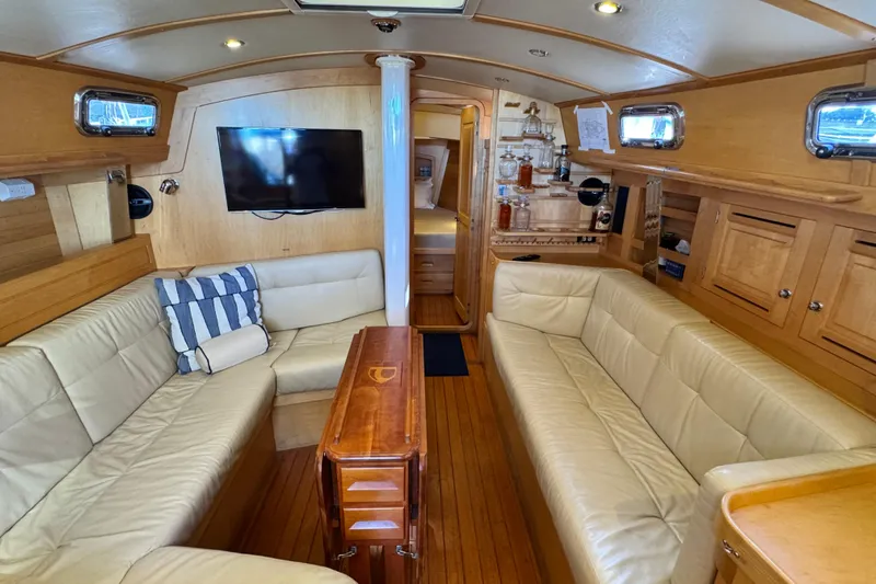 Munequita Yacht Photos Pics Luxurious interior of 2013 Tartan 4000 yacht with leather seating and wooden finishes.