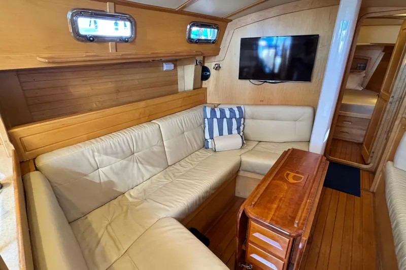 Munequita Yacht Photos Pics Interior of 2013 Tartan 4000 yacht with cozy seating and wooden accents.