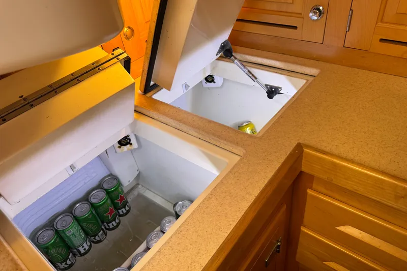 Munequita Yacht Photos Pics Built-in coolers with beverages in a 2013 Tartan 4000 yacht kitchen.