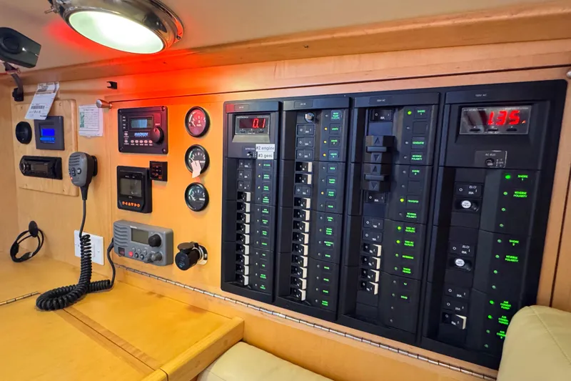 Munequita Yacht Photos Pics Control panel inside a 2013 Tartan 4000 yacht, featuring various switches and gauges.