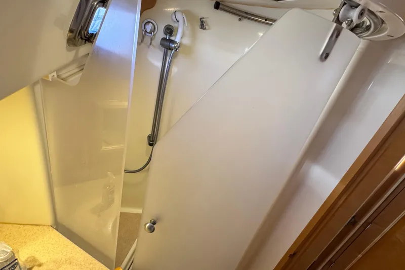 Munequita Yacht Photos Pics Shower area in 2013 Tartan 4000 yacht with modern fixtures and frosted door.