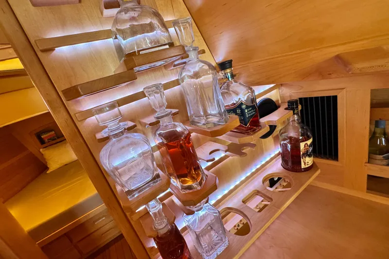 Munequita Yacht Photos Pics Luxurious wooden bar setup in a 2013 Tartan 4000 yacht interior.