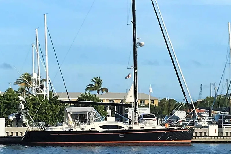 Solitude Yacht Photos Pics Sailing yacht Passport 545, 2018 model, docked at marina with clear blue sky.
