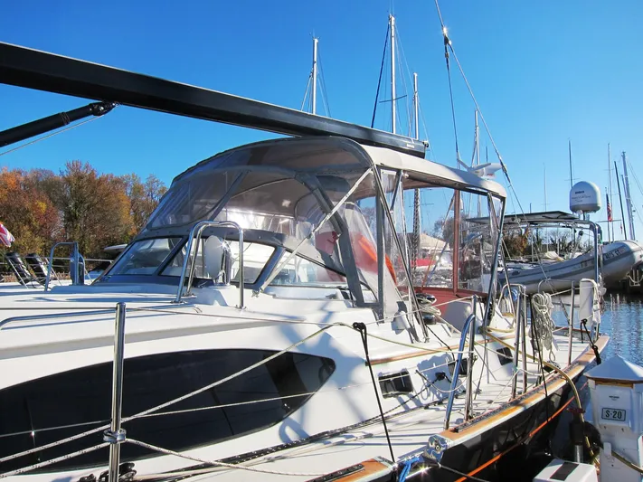 Solitude Yacht Photos Pics Sailboat docked at marina, Passport 545 model, 2018, under clear blue sky.