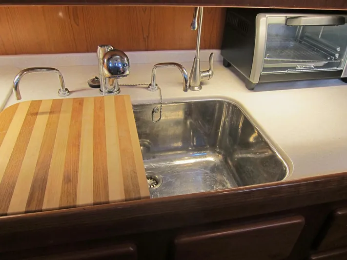 Solitude Yacht Photos Pics Modern kitchen sink with cutting board and toaster, Passport 545, 2018 model.