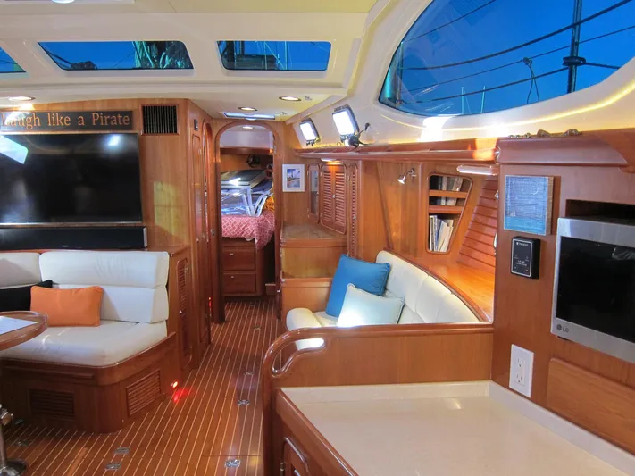 Solitude Yacht Photos Pics Luxurious interior of 2018 Passport 545 yacht with wood finish and plush seating.