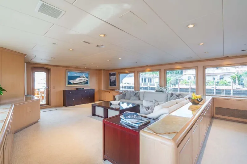 Chanson Yacht Photos Pics Luxurious interior of 1995 Christensen Tri-Deck yacht with elegant furnishings and large windows.
