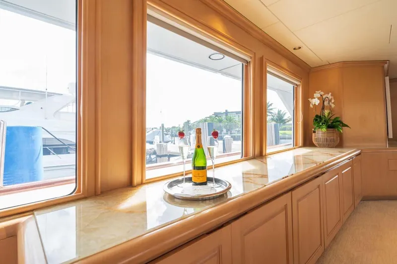 Chanson Yacht Photos Pics Luxurious interior of 1995 Christensen Tri-Deck yacht with champagne and elegant decor.