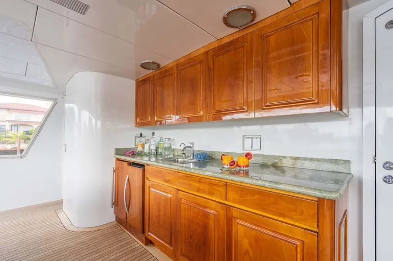 Chanson Yacht Photos Pics Luxurious wooden cabinetry and countertop in 1995 Christensen Tri-Deck yacht interior.