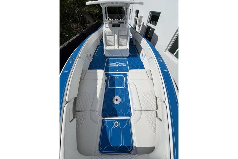  Yacht Photos Pics 2012 Deep Impact 399 Sport boat with blue and white interior design.