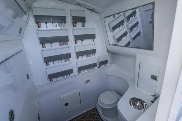  Yacht Photos Pics Interior of 2012 Deep Impact 399 Sport boat with bathroom and electrical panel.