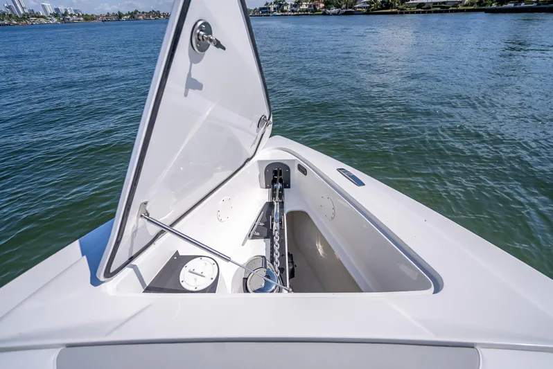  Yacht Photos Pics 2025 Nor-Tech 340 Sport boat anchor compartment open on calm water.