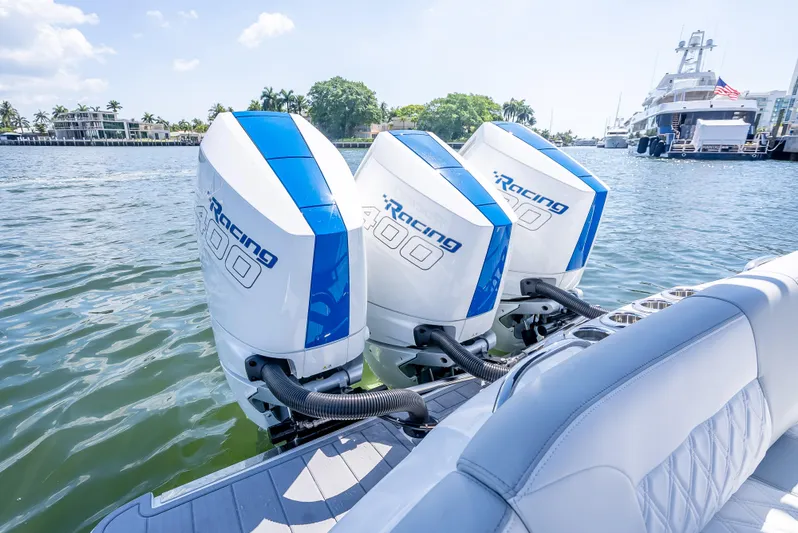  Yacht Photos Pics 2025 Nor-Tech 340 Sport boat with triple Racing outboard engines on a sunny day.