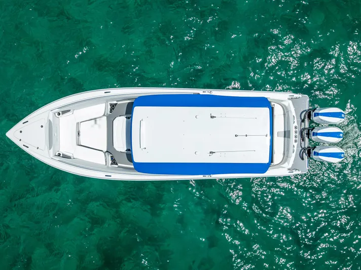  Yacht Photos Pics 2025 Nor-Tech 340 Sport boat on turquoise water, aerial view.