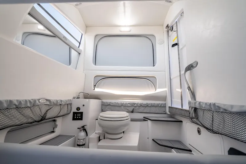  Yacht Photos Pics Interior of 2025 Nor-Tech 340 Sport boat, featuring a modern bathroom with sleek design.