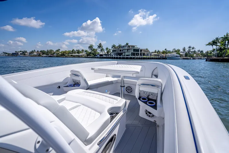  Yacht Photos Pics 2025 Nor-Tech 340 Sport boat on water, featuring sleek white seating and modern design.