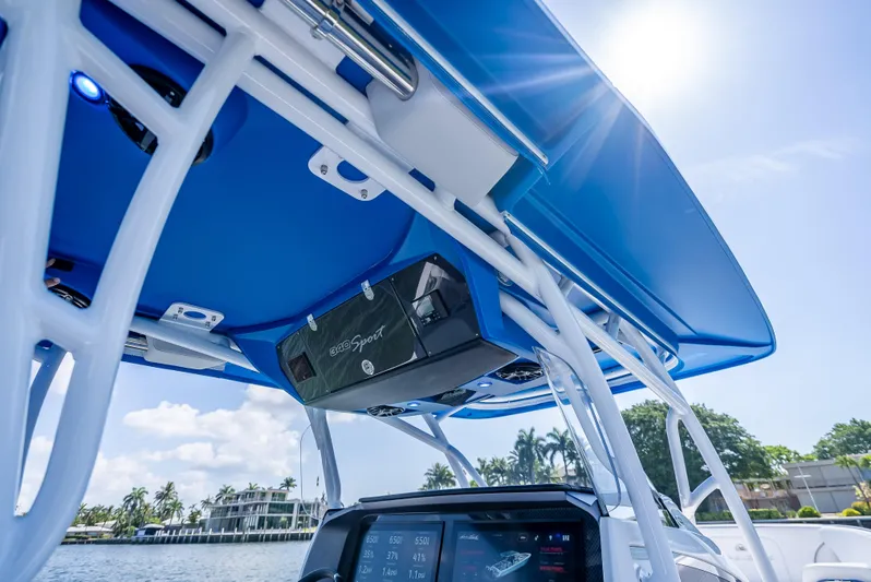  Yacht Photos Pics 2025 Nor-Tech 340 Sport boat with blue canopy and advanced navigation system.