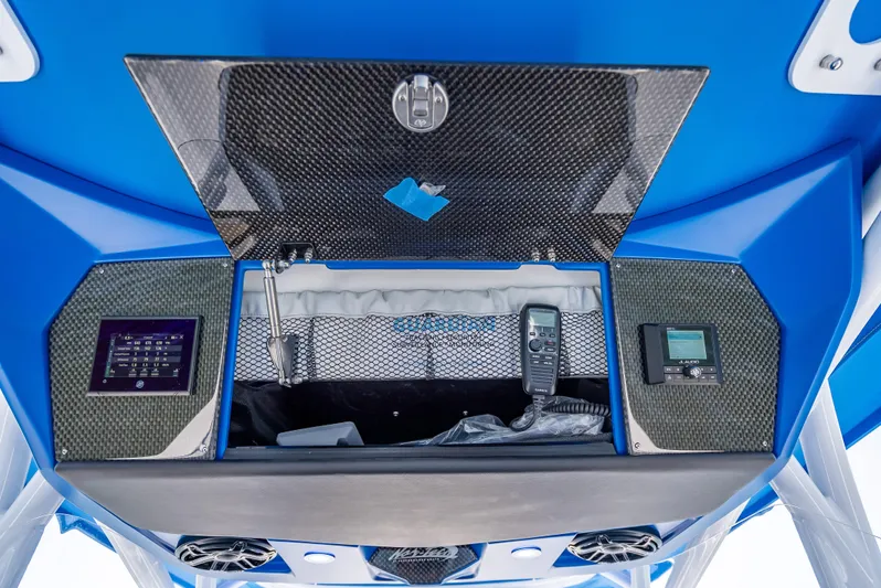  Yacht Photos Pics 2025 Nor-Tech 340 Sport boat dashboard with advanced controls and storage compartment.