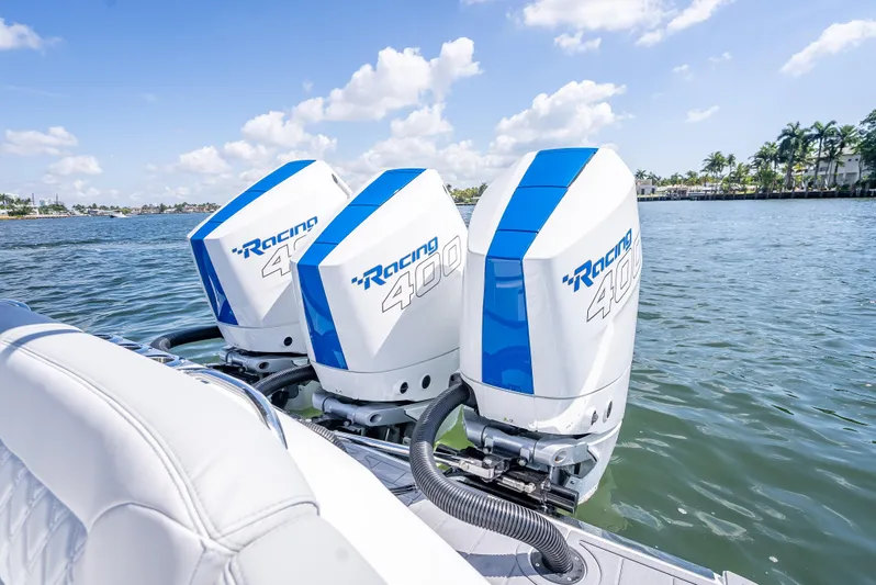  Yacht Photos Pics 2025 Nor-Tech 340 Sport boat with triple Racing 400 outboard engines on a sunny day.