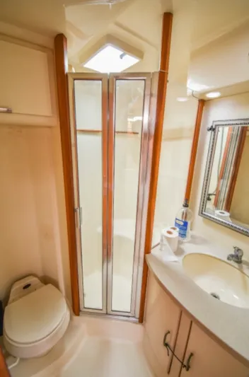Rocky N Friends Yacht Photos Pics 2003 Luhrs 36 Open yacht bathroom with shower, sink, and toilet.