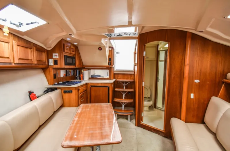 Rocky N Friends Yacht Photos Pics 2003 Luhrs 36 Open yacht interior with kitchen, seating, and bathroom.