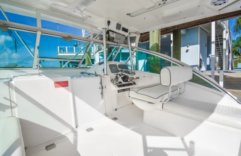 Rocky N Friends Yacht Photos Pics 2003 Luhrs 36 Open boat interior with helm and seating area.