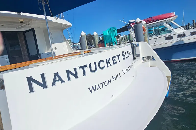 Nantucket Sleighride Yacht Photos Pics Custom 2005 Sea Raider Catamaran docked, featuring "Nantucket Sleigh" nameplate.