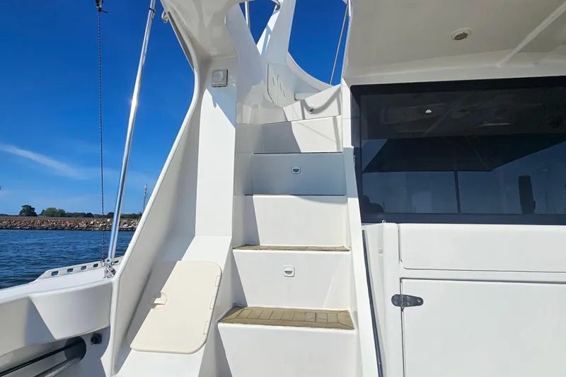 Nantucket Sleighride Yacht Photos Pics Staircase on 2005 Custom Sea Raider Catamaran with ocean view in background.