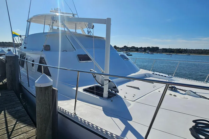 Nantucket Sleighride Yacht Photos Pics Custom 2005 Sea Raider Catamaran docked, showcasing sleek design and spacious deck.