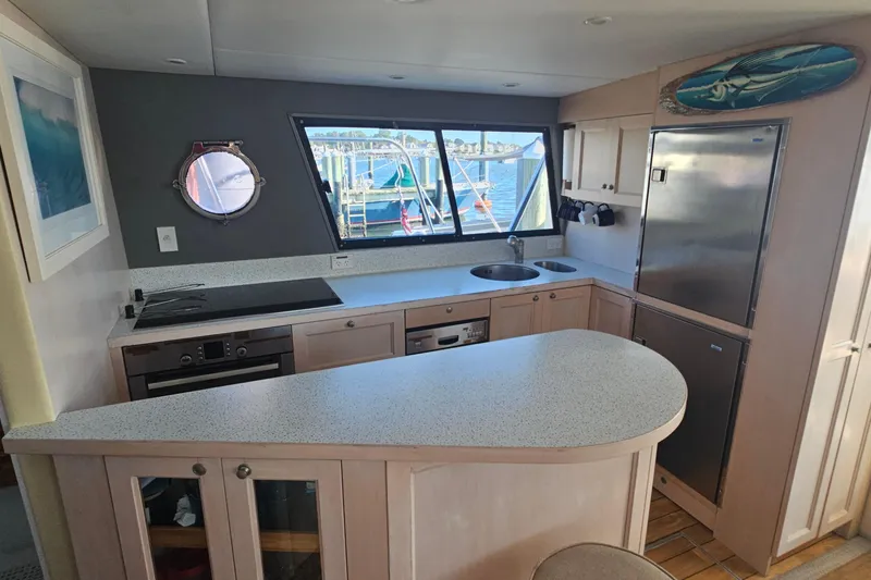 Nantucket Sleighride Yacht Photos Pics Modern kitchen interior on 2005 Custom Sea Raider Catamaran with ocean view.