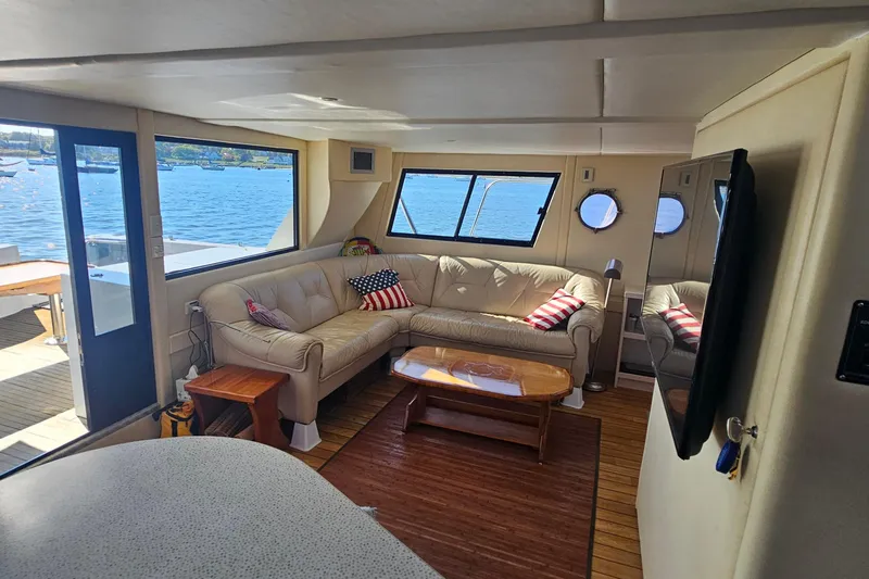 Nantucket Sleighride Yacht Photos Pics Luxurious interior of 2005 Custom Sea Raider Catamaran with leather seating and scenic windows.