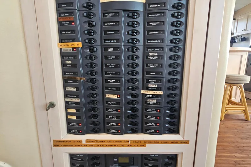 Nantucket Sleighride Yacht Photos Pics Electrical control panel on a 2005 Custom Sea Raider Catamaran, featuring labeled switches and controls.