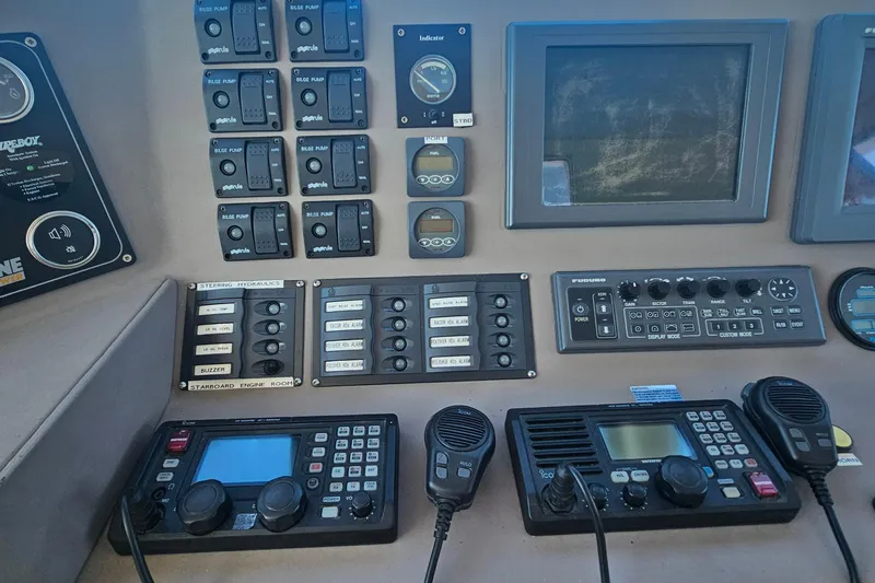 Nantucket Sleighride Yacht Photos Pics Control panel of a 2005 Custom Sea Raider Catamaran with navigation and communication equipment.