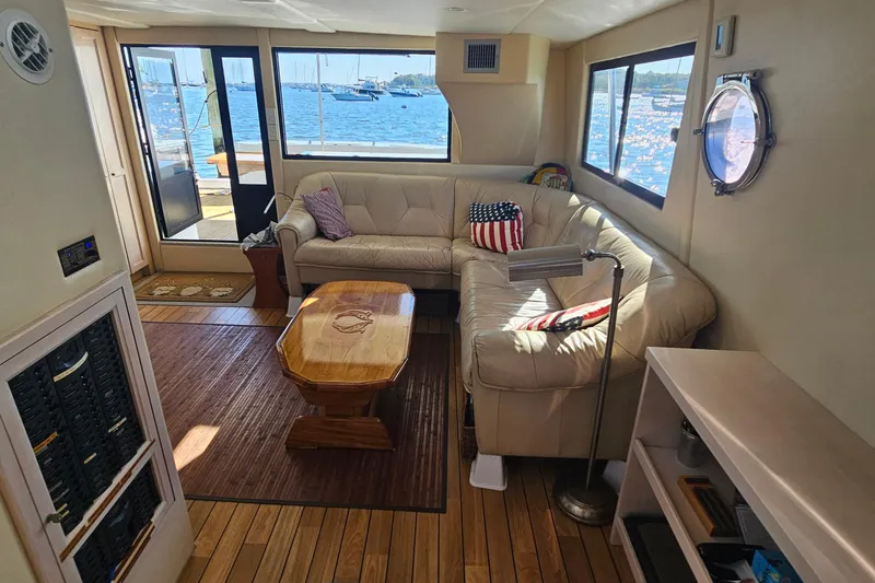 Nantucket Sleighride Yacht Photos Pics Luxurious interior of 2005 Custom Sea Raider Catamaran with leather seating and ocean view.