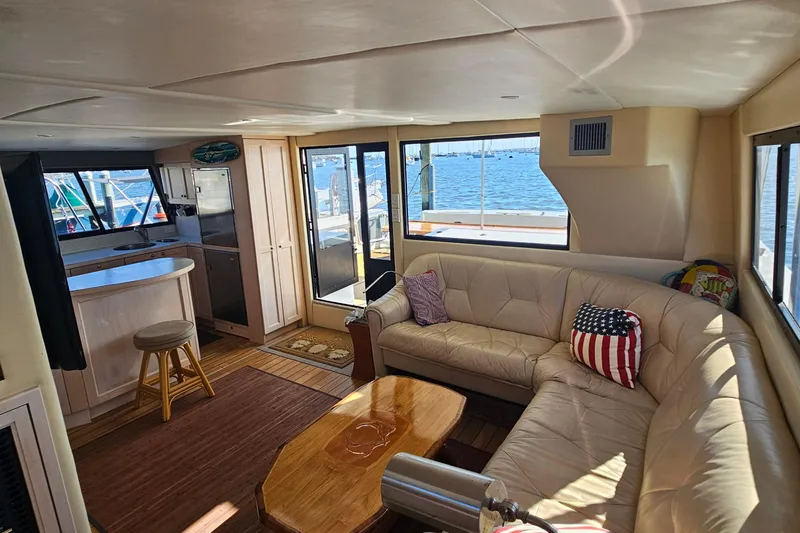 Nantucket Sleighride Yacht Photos Pics Luxurious interior of 2005 Custom Sea Raider Catamaran with leather seating and ocean view.