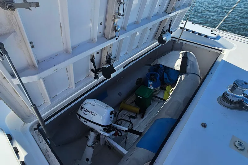 Nantucket Sleighride Yacht Photos Pics Open storage compartment on 2005 Custom Sea Raider Catamaran with Tohatsu motor and equipment.