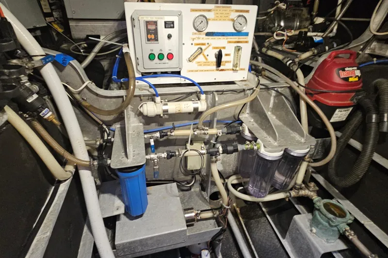 Nantucket Sleighride Yacht Photos Pics Engine room of 2005 Custom Sea Raider Catamaran with complex machinery and control panel.