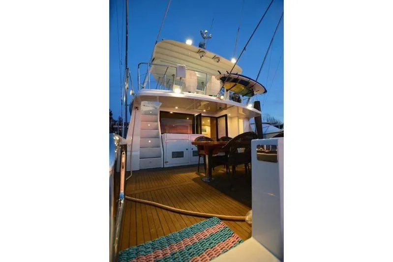 Nantucket Sleighride Yacht Photos Pics Custom 2005 Sea Raider Catamaran with elegant deck and evening lighting.
