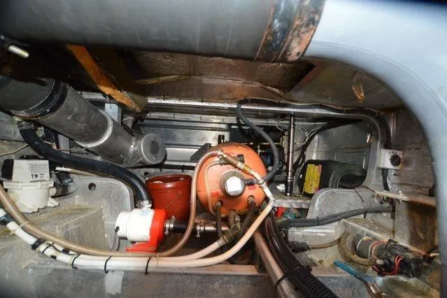 Nantucket Sleighride Yacht Photos Pics Engine compartment of a 2005 Custom Sea Raider Catamaran, showcasing mechanical components and wiring.