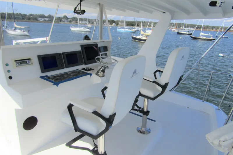 Nantucket Sleighride Yacht Photos Pics Helm of 2005 Custom Sea Raider Catamaran with dual seats and navigation equipment.