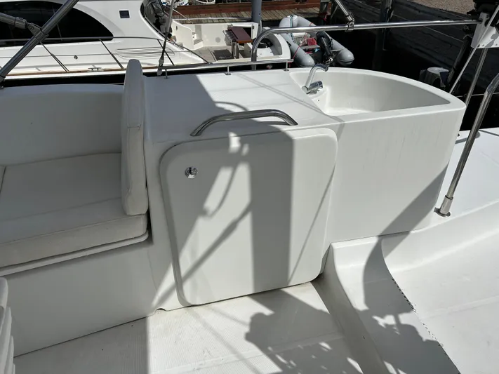 Tryst Yacht Photos Pics 2006 Beneteau 42 Swift Trawler deck with seating and storage compartment.