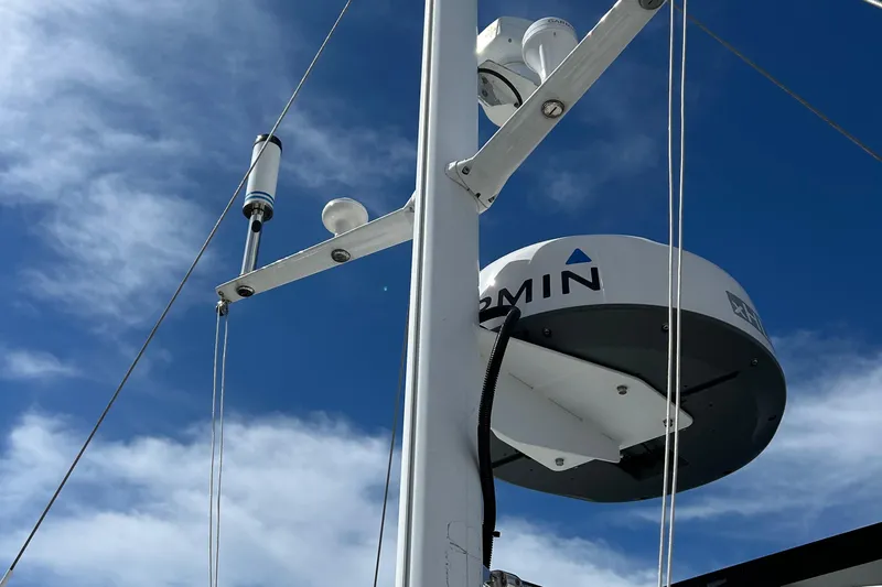 Tryst Yacht Photos Pics Radar equipment on a 2006 Beneteau 42 Swift Trawler against a blue sky.
