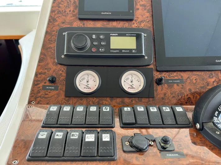 Tryst Yacht Photos Pics Control panel of a 2006 Beneteau 42 Swift Trawler with gauges and switches.