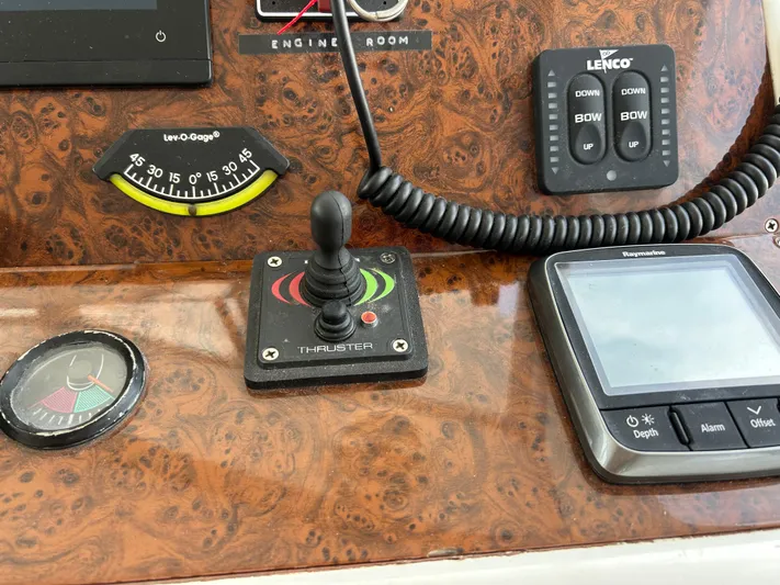 Tryst Yacht Photos Pics Control panel of a 2006 Beneteau 42 Swift Trawler with navigation instruments and thruster joystick.