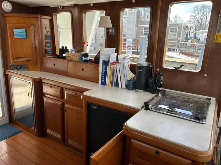 Tryst Yacht Photos Pics Interior of 2006 Beneteau 42 Swift Trawler with wooden cabinetry and modern amenities.