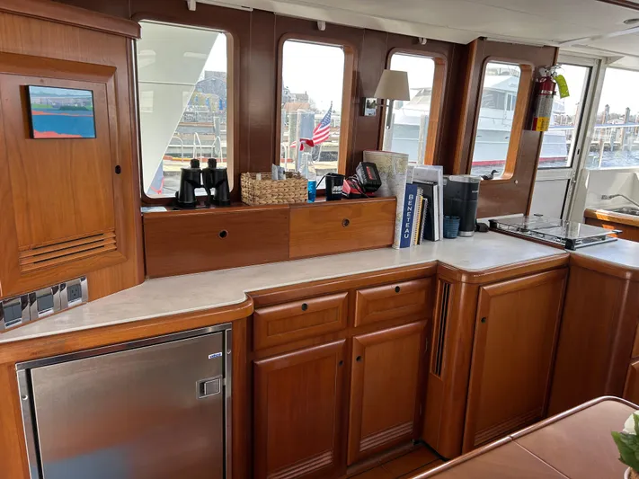 Tryst Yacht Photos Pics Interior of 2006 Beneteau 42 Swift Trawler with wooden cabinetry and modern appliances.