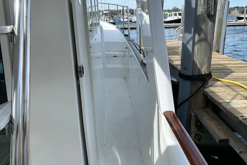 Tryst Yacht Photos Pics Side deck of 2006 Beneteau 42 Swift Trawler docked at marina.