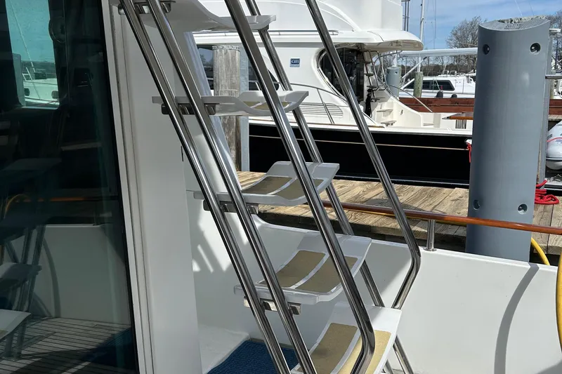 Tryst Yacht Photos Pics Stainless steel stairs on a 2006 Beneteau 42 Swift Trawler yacht.