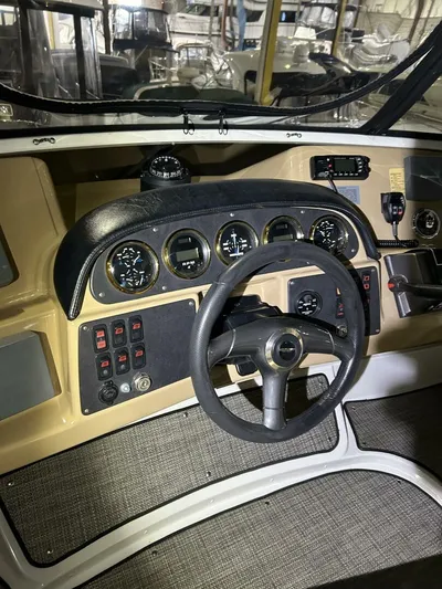 Second Knot Yacht Photos Pics 2003 Carver 396 Aft Cabin MY helm with gauges and controls.